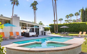 A heated pool, pool loungers