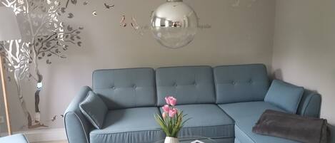 Deluxe Apartment | Living area | Flat-screen TV