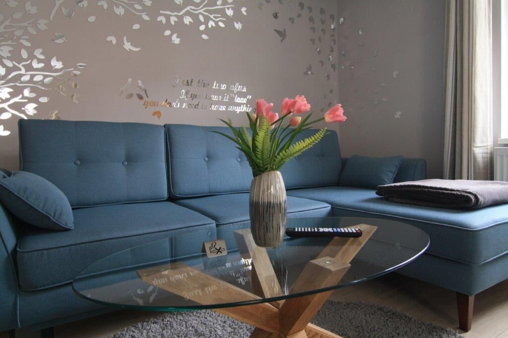Deluxe Condo | Living area | Flat-screen TV