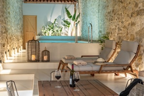 Relax in style with a comfortable lounge chair and enjoy a meal or social gathering at this serene outdoor space.