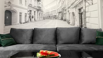 Deluxe Studio Suite (4) | Living room | 42-inch plasma TV with cable channels, TV