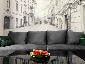 Deluxe Studio Suite (4) | Living room | 42-inch plasma TV with cable channels, TV