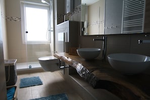 Exclusive Condo | Bathroom | Shower, hair dryer, towels, toilet paper