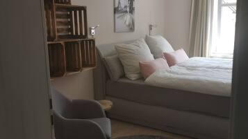 Down duvets, blackout curtains, iron/ironing board, travel cot