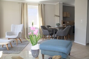 Exclusive Condo | Living area | 40-inch flat-screen TV with satellite channels, TV