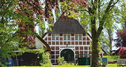 Cozy family pension with lots of space under thatched roof directly on the dike