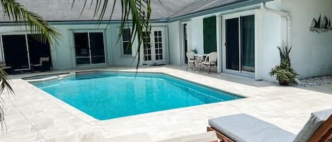 Outdoor pool, a heated pool, sun loungers