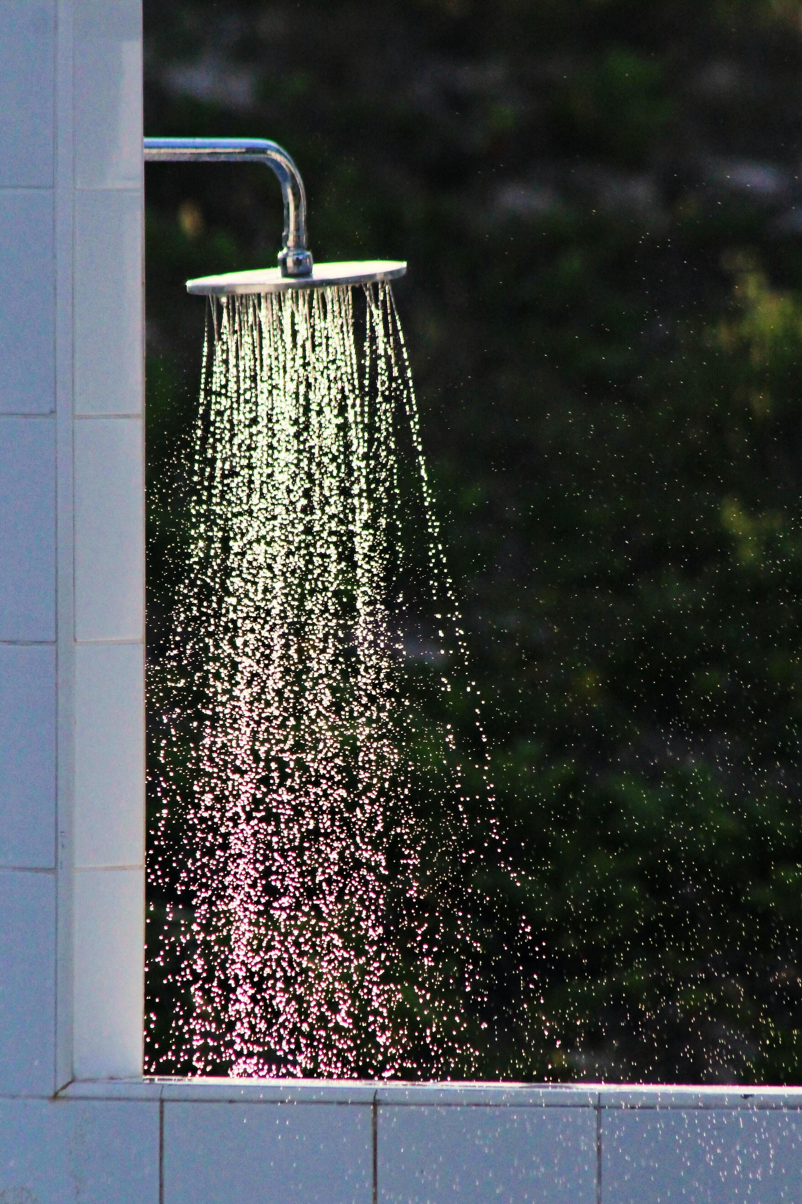 A shower with water spraying down.