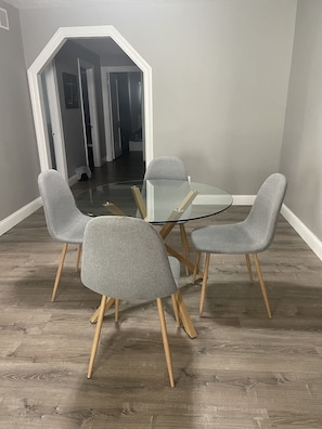 Enjoy meals in this dining area with a round table and four comfortable chairs.