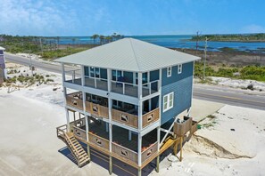 Enjoy ocean views from the upper-level balcony of this beachfront property.