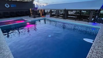 Outdoor pool, open 9:00 AM to 9:00 PM, pool loungers