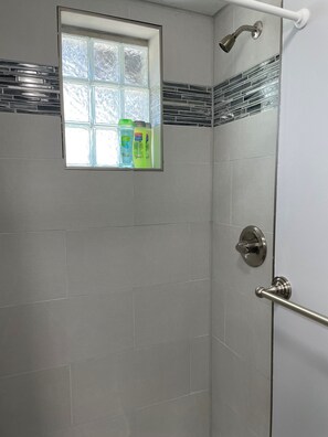 Shower, hair dryer, towels, soap