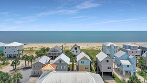 A coastal residential area with houses and a beach in the background. - Sammy's Old Place (Port St. Joe)