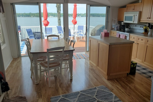 Dining and kitchen with double sliding doors onto deck - great views