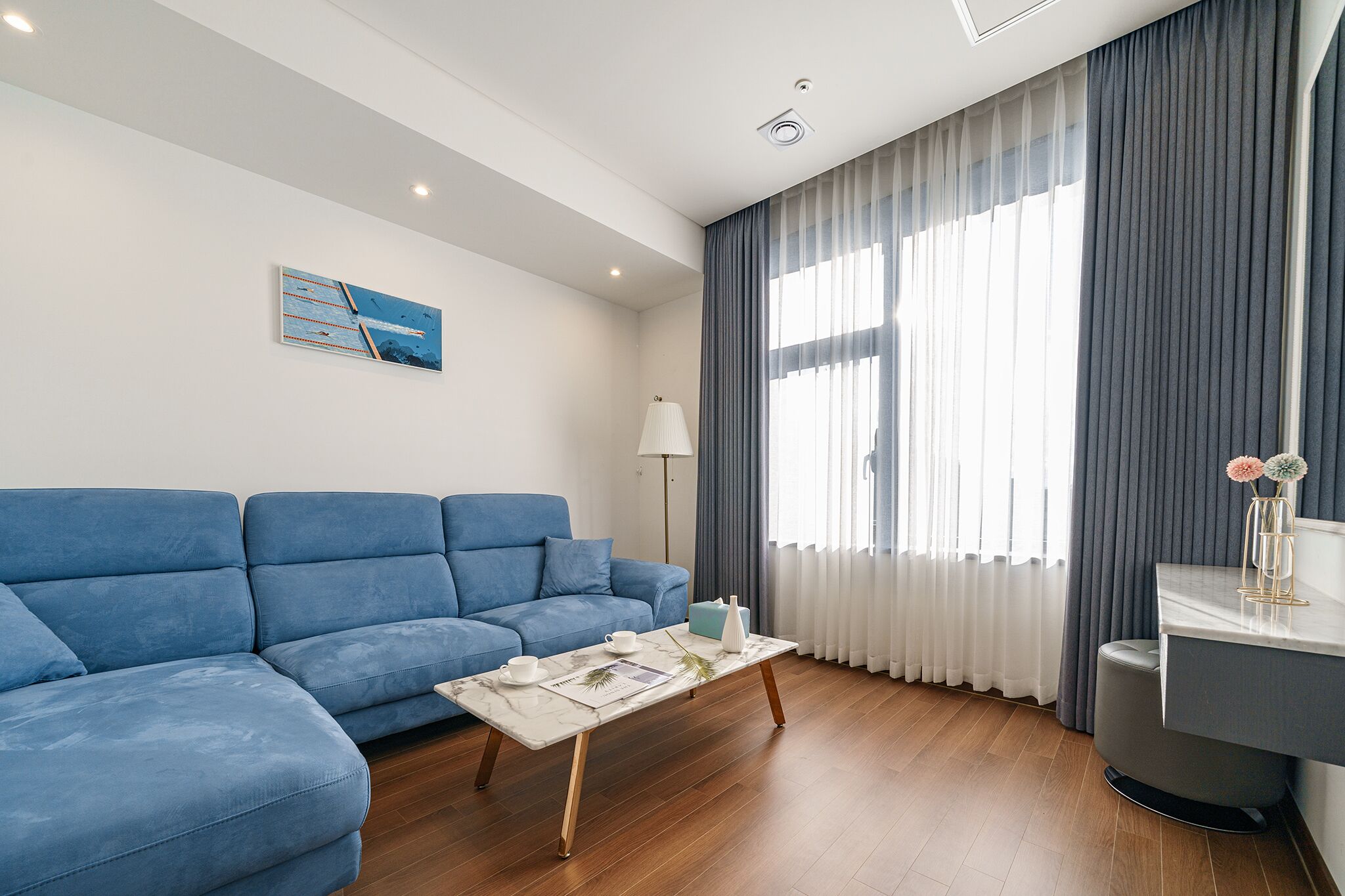 premium studio suite | living area | 55-inch smart tv with digital channels, tv, heated floors