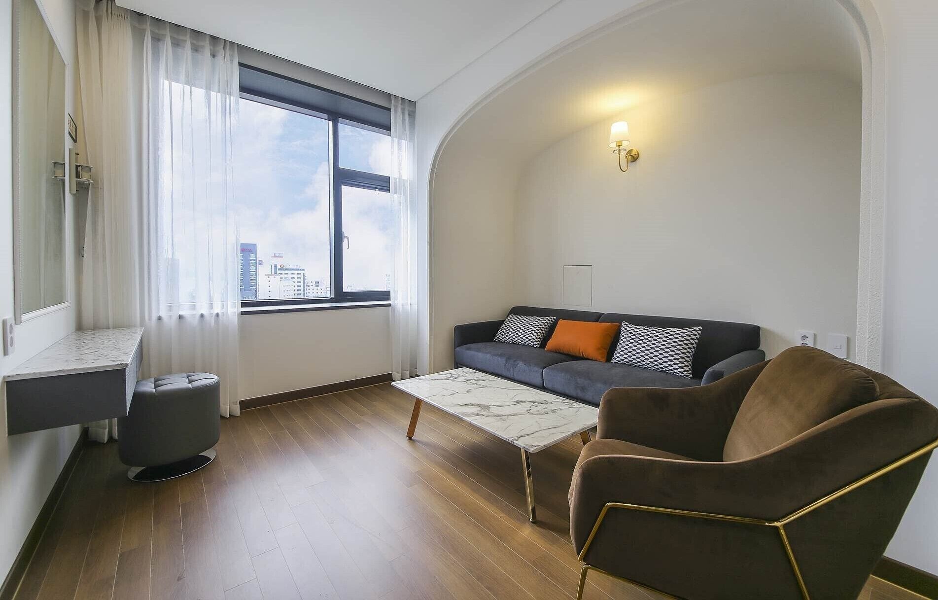 premium studio suite | living area | 55-inch smart tv with digital channels, tv, heated floors