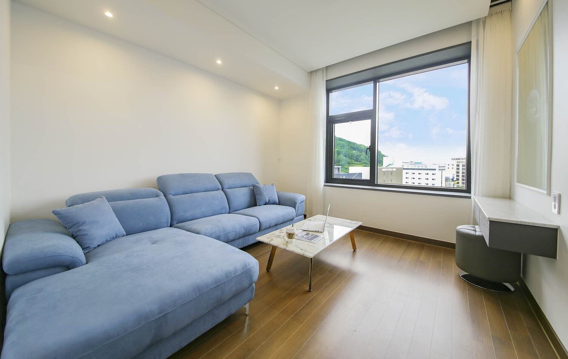 premium studio suite | living area | 55-inch smart tv with digital channels, tv, heated floors