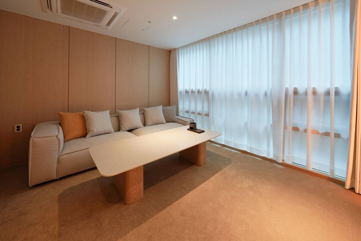 Annex Standard Double Suite | Living room | 55-inch TV with cable channels
