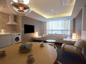 Annex Private Spa Suite | Living area | 55-inch TV with cable channels
