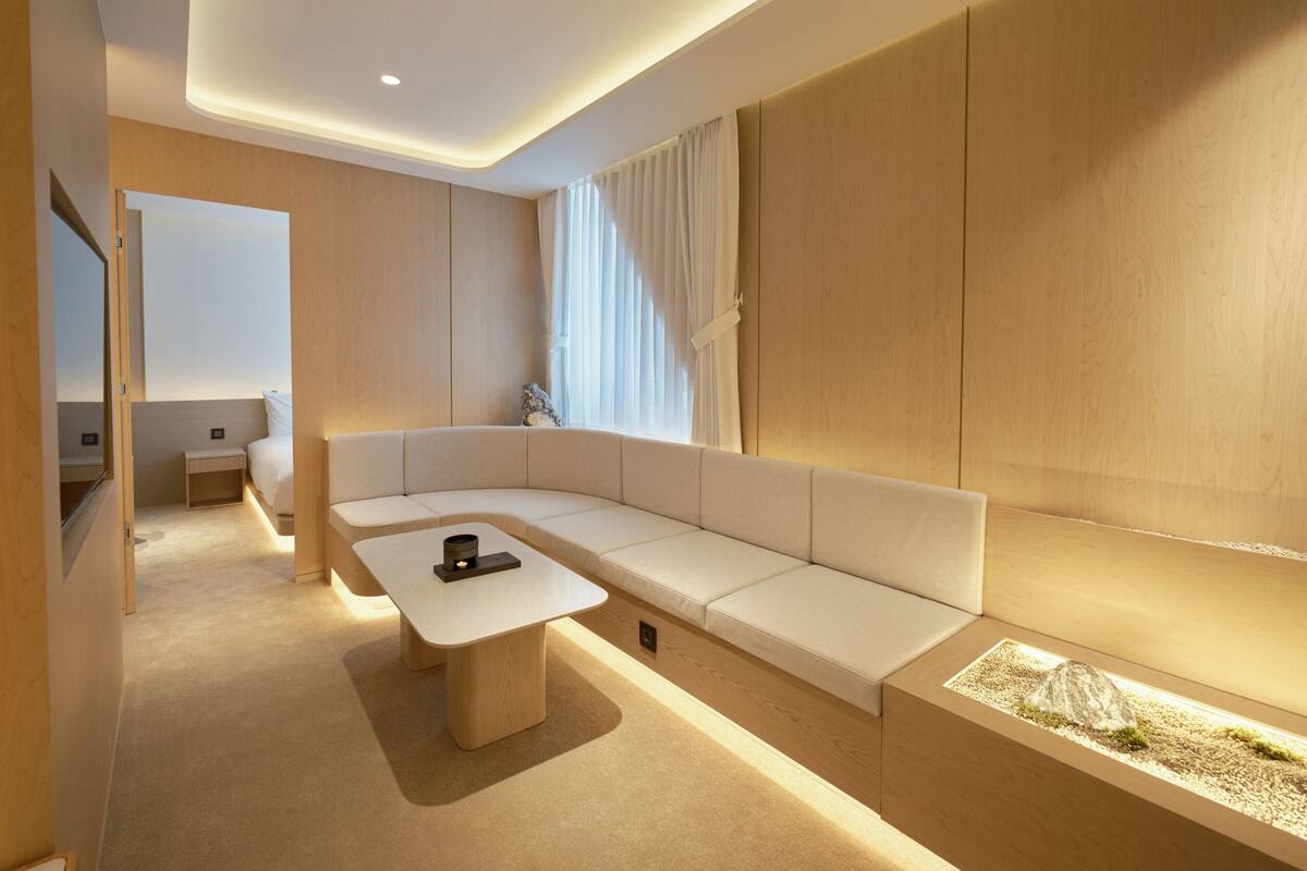 Annex Private Suite | Living area | 55-inch TV with cable channels