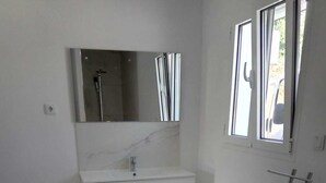 A modern bathroom with a white vanity, a mirror, and a shower. - VILLA FOR 6 PEOPLE, POOL AND BBQ (Mioma)
