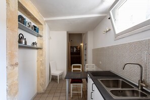Fridge, microwave, electric kettle, cookware/dishes/utensils