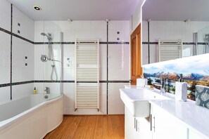 Bathtub, hair dryer, towels, soap