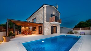 A modern two-story house with a swimming pool, outdoor dining area, and a covered patio. - Modern Villa Baraka with a pool (Kanfanar)