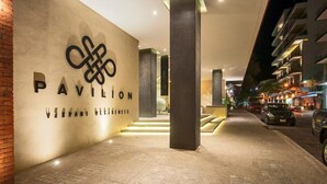 A hotel entrance with a modern design, featuring a prominent sign for 'Pavilion Vibrant Residences'. - Casa Paraiso - Luxury 2 Bed 3 Bath at Pavilion Lux (Puerto Vallarta)