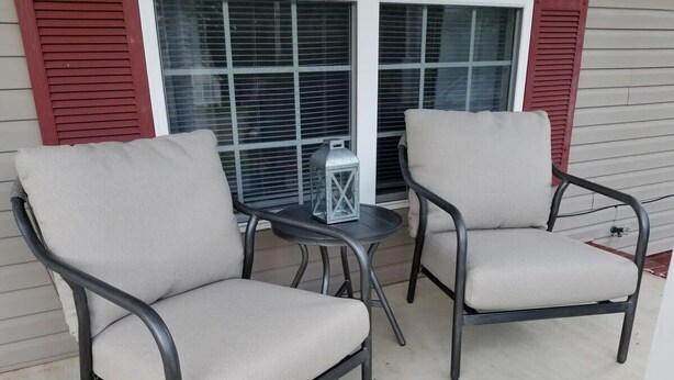Two chairs with metal frames and fabric seats on a concrete patio. - Spacious 3BR 2BA, 11 Min to Cummins Falls Park (Cookeville)