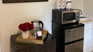 A kitchen with a stainless steel refrigerator, a microwave, and a coffee maker on the countertop. - Paris Suite @Carolina Beach, Walk to Carolina Beach State Park (Carolina Beach)