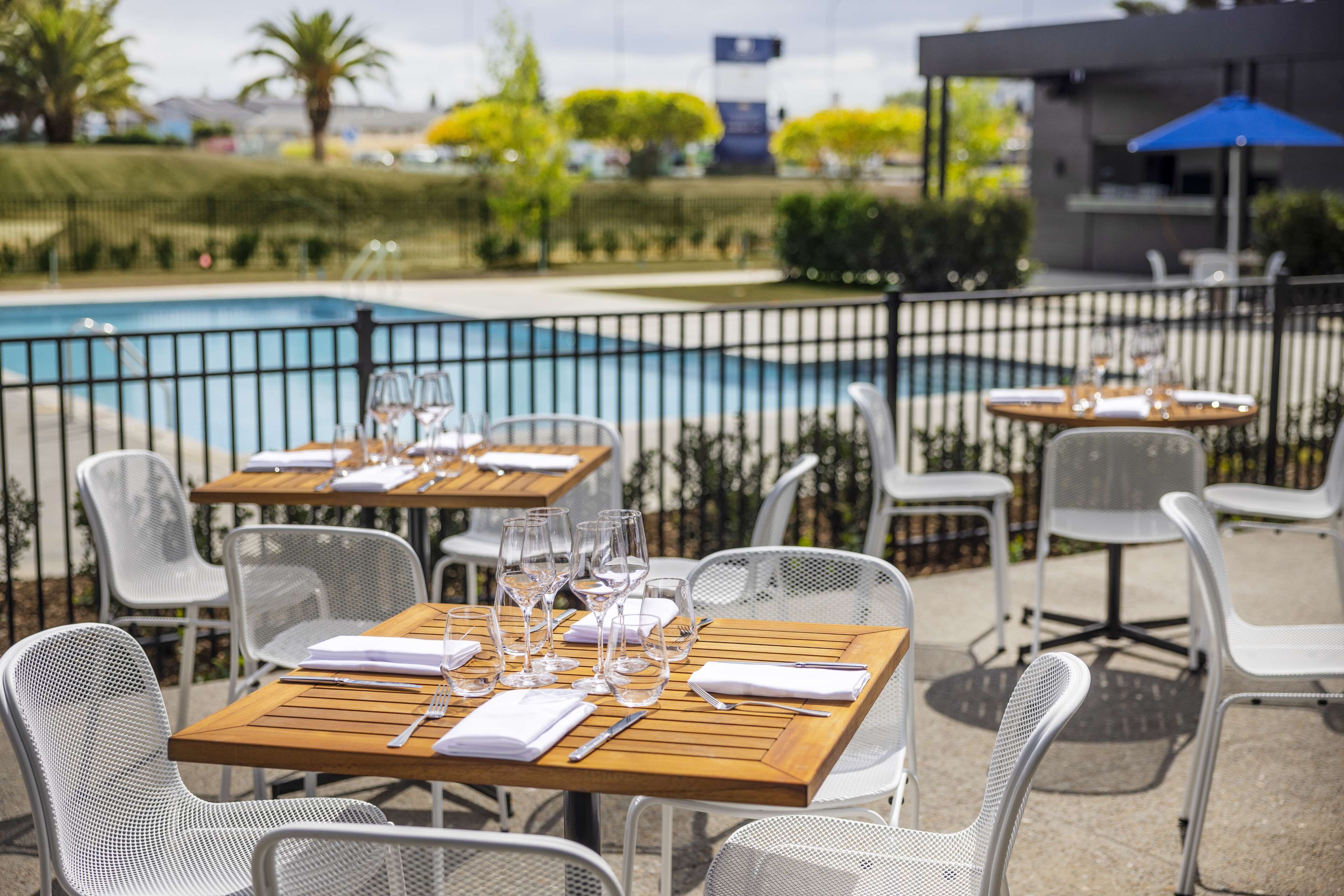 outdoor pool, open 7:00 am to 6:00 pm, pool umbrellas, pool loungers