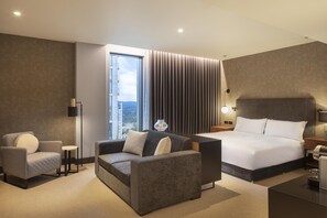 Junior Suite (Super King Access Junior Suite) | Living area | 55-inch LCD TV with satellite channels, TV, pay movies - Hilton Woking (Woking)
