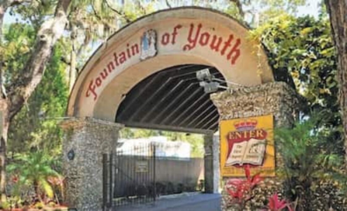 An entrance gate with a sign reading "Fountain of Youth."