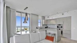 A modern apartment with a living area, kitchen, and dining space. - Enjoy the perfect blend of comfort, elegance, and luxury in this stunning 3-bedroom apartment (Hollywood)