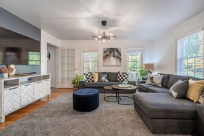 Smart TV, fireplace, table football, books