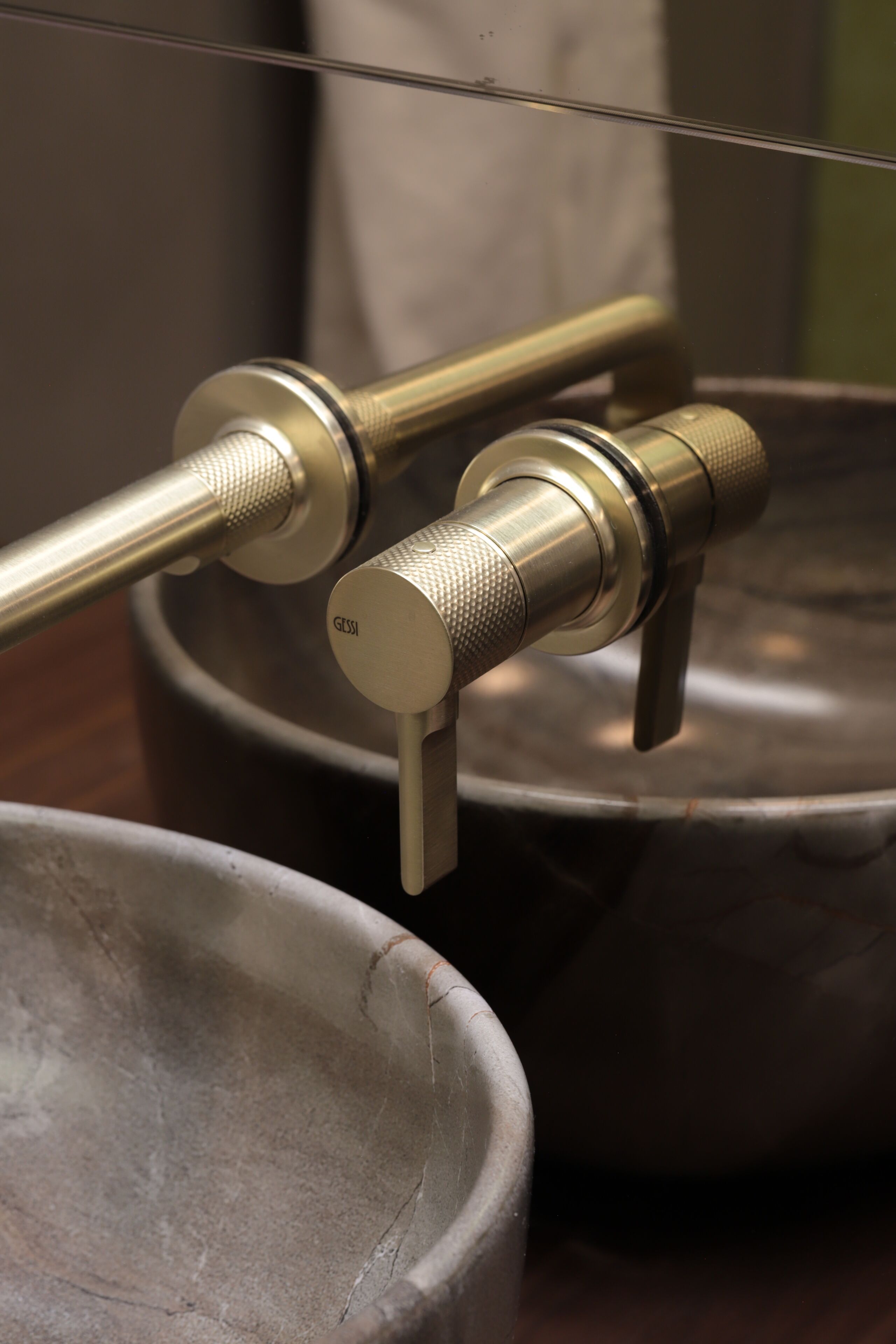 A bathroom sink with a modern faucet and a large basin.