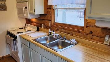 Microwave, coffee/tea maker, cookware/dishes/utensils, spices