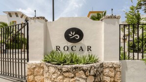 A sign with the name 'ROCAR' and a logo, surrounded by a stone wall and a metal gate. - 5 Min Driving to he Beach, 6 People, 5 Beds, Pool, wifi (Playa del Carmen)