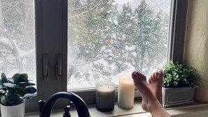 A bathroom with a window, a sink, and two candles. - Mountain Adobe Home in Jemez Springs NEW HOT TUB, Mt. Views "Raven House" (Jemez Springs)