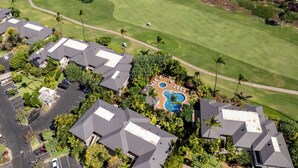 A residential area with multiple houses, a golf course, and a swimming pool. - Grand Champions in Wailea – Spacious Villa Near Pool w/ Ocean & Sunset Views (Wailea)