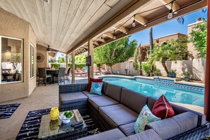 A covered patio area with a pool, outdoor furniture, and a view of the surrounding neighborhood. - 3 Miles to Kierland Com, Fab Patio,  Pool (Scottsdale)