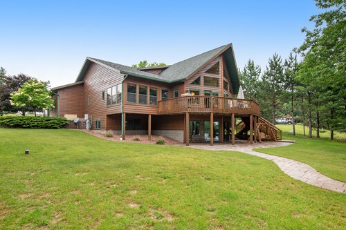 Dog-friendly lakefront getaway with dock, firepit, wet bar, game room, & AC