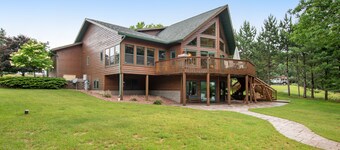 Dog-friendly lakefront getaway with dock, firepit, wet bar, game room, & AC