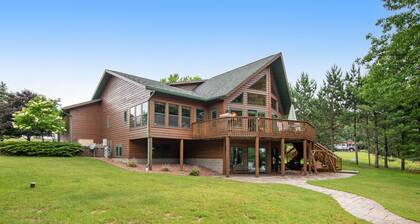 Dog-friendly lakefront getaway with dock, firepit, wet bar, game room, & AC