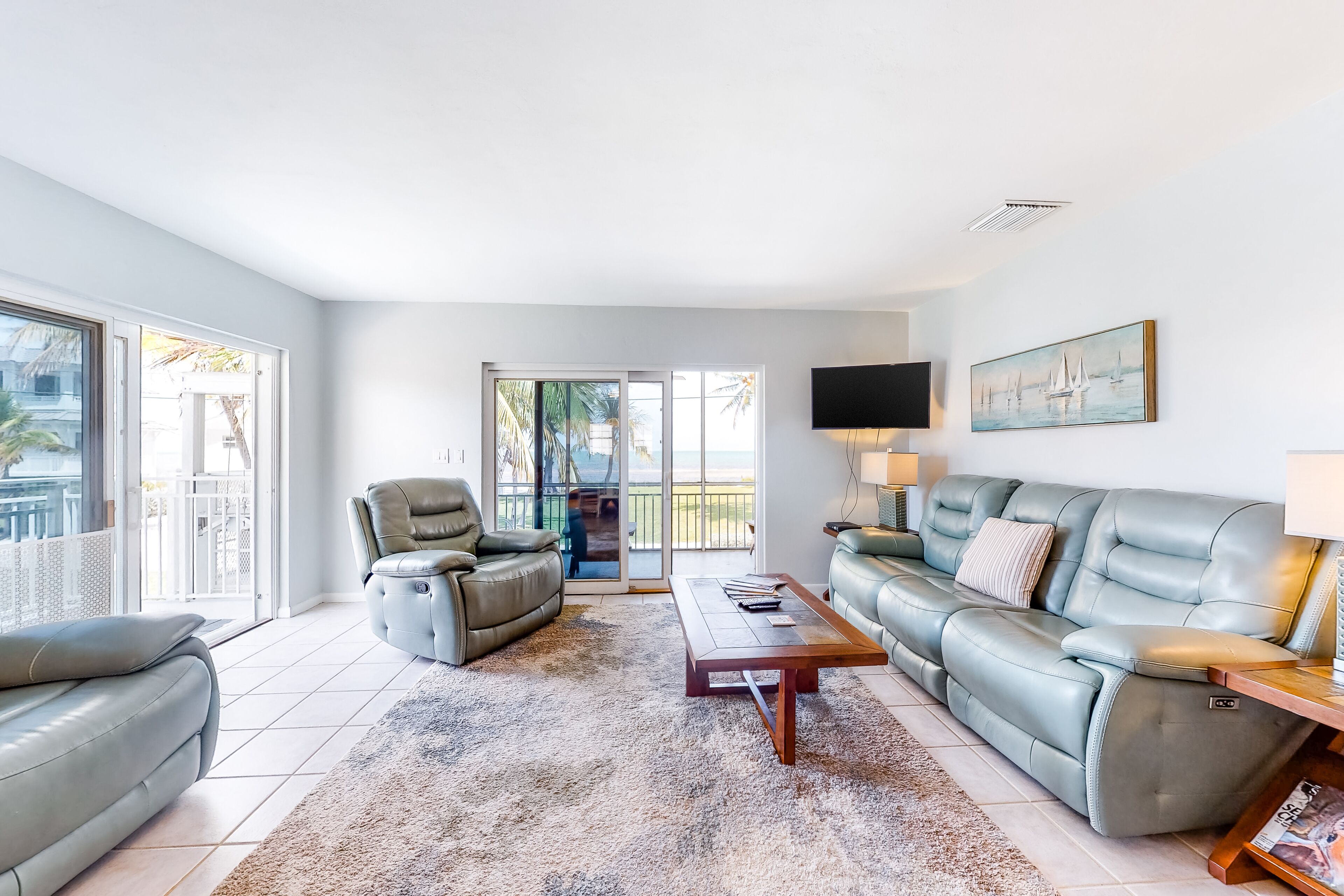 Dog-friendly escape with private dock, porch, balcony, water view, & central AC