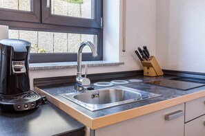 Fridge, stovetop, coffee/tea maker, electric kettle