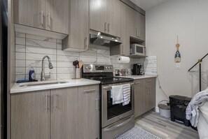 Microwave, oven, stovetop, dishwasher - Gorgeous 2 Bedroom 1 Bathroom Guest Suite (Calgary)
