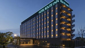 A multi-story hotel with a prominent sign reading "HOTEL ROUTE INN". - Hotel Route-Inn Yonago (Yonago)