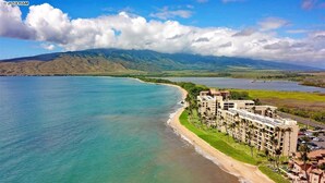 A coastal hotel with a beachfront view, multiple buildings, and a road leading to the beach. - Big Ocean View from your Sugar Beach Retreat -King Bed, Central AC, WiFi  #208 (Kihei)